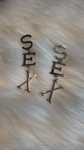 S E X earrings
