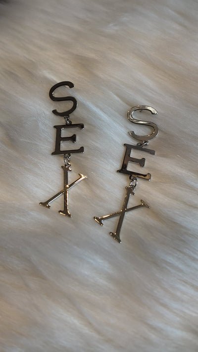 S E X earrings